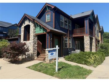 Charming two-story home showcasing stone accents and a welcoming front porch at 2552 W 82Nd Ln # C, Westminster, CO 80031
