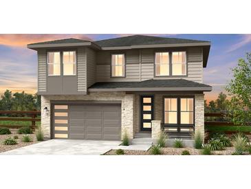 Charming two-story home featuring a modern design with stone accents and an attached two-car garage at 7243 Prairie Sage Ln, Littleton, CO 80125