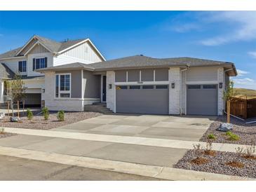 Charming single-story home with a spacious three-car garage and well-maintained landscaping at 25224 E Warren Pl, Aurora, CO 80018