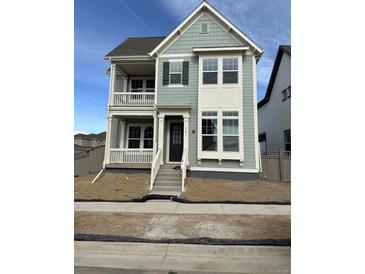 Charming two-story home featuring a double porch and stylish exterior accents at 191 Washington St, Erie, CO 80516