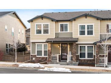 Charming two-story home with a welcoming front porch and stone accents at 2907 Distant Rock Ave, Castle Rock, CO 80109
