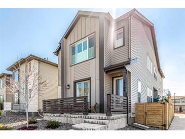 Attractive two-story home with a modern facade, a charming porch, and well-maintained landscaping at 10524 Eby Cir, Lone Tree, CO 80124