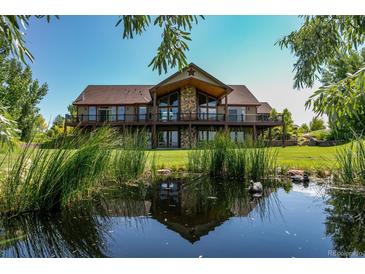 Luxury home with pond and expansive lawn at 69649 E Briarwood Pl, Byers, CO 80103