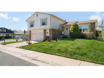 Charming two-story home with a well-manicured front yard and attached garage at 11011 Kendall Way, Westminster, CO 80020