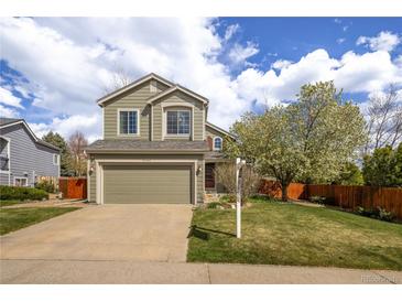 Charming two-story home with a well-maintained lawn, beautiful landscaping, and an attached two-car garage at 5324 S Malta Way, Centennial, CO 80015