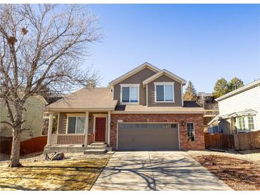 Charming two-story home with a well-maintained front yard and inviting curb appeal at 9703 Ogden Ct, Thornton, CO 80229