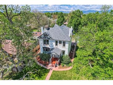 Stunning aerial view of a stately home with mature trees and meticulously landscaped grounds at 5127 Lowell Blvd, Denver, CO 80221