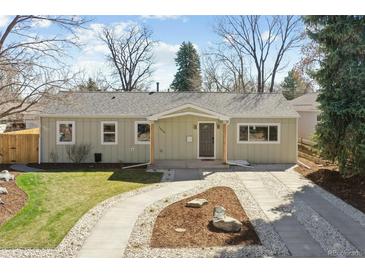 Charming single-story home with a well-maintained front yard and inviting walkway to the front door at 1430 S Glencoe St, Denver, CO 80222