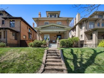 Charming brick home with well-maintained lawn and inviting front porch in a desirable neighborhood at 1265 Saint Paul St, Denver, CO 80206
