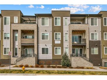Beautiful condo with brick and siding, balconies, and landscaped grounds at 480 E Fremont Pl # 308, Centennial, CO 80122
