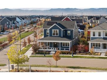 Charming two-story home featuring a welcoming front porch, modern architecture, and a beautifully landscaped neighborhood at 5965 Hanover St, Denver, CO 80238