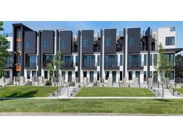 Modern townhomes with black and white exteriors, balconies, and spiral staircases at 3408 W 18Th Ave, Denver, CO 80204