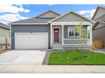Charming single-Gathering home with a two-car garage and a cozy front porch at 770 N Deer Park St, Watkins, CO 80137