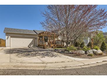Charming single-Gathering home with a welcoming front porch and well-maintained landscaping at 1141 Beech St, Fort Lupton, CO 80621