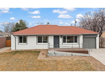 Charming ranch-style home with red roof, white siding, and a convenient ramp for easy access at 1436 S Yates St, Denver, CO 80219