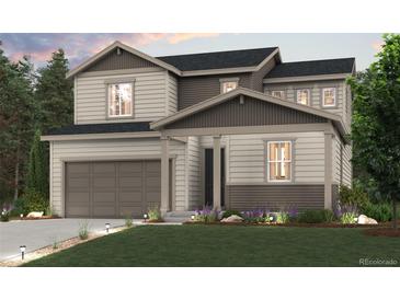 Beautiful two-story home with a two-car garage, manicured lawn, and charming curb appeal at 1300 Loraine N Cir, Lafayette, CO 80026