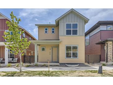 Charming two-story home featuring a covered front porch and modern design elements at 858 Promenade Dr, Superior, CO 80027