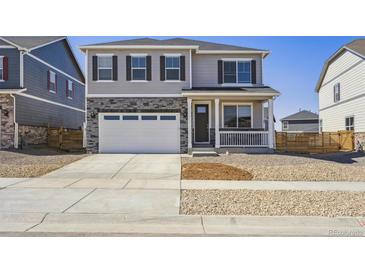 Charming two-story home with a two-car garage and inviting curb appeal at 27574 E Byers Ave, Aurora, CO 80018