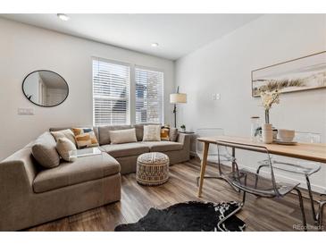 Cozy living room with large windows, comfortable seating, and stylish decorative accents at 2036 S Vance Way, Lakewood, CO 80227