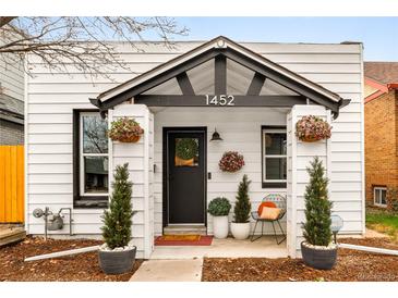 Charming home featuring a welcoming front entrance, well-manicured landscaping, and great curb appeal at 1452 S Logan St, Denver, CO 80210