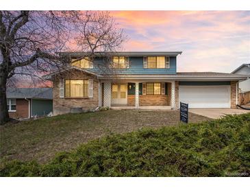 Charming two-story home with brick accents and a well-maintained front yard at 4653 Kirkwood St, Boulder, CO 80301
