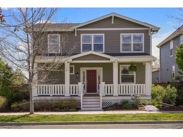 Charming two-story home featuring a welcoming front porch and well-maintained landscaping at 3476 Beeler Ct, Denver, CO 80238