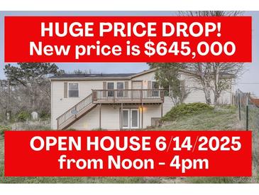 Split level home featuring a large price drop, open house, lower level entrance, and a deck with stairs at 1062 Pinon Ln, Elizabeth, CO 80107