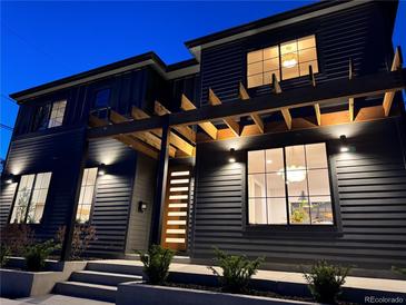 Stunning two-story home exterior featuring modern design and architectural lighting and wooden pergola at 3649 W 21St Ave, Denver, CO 80211