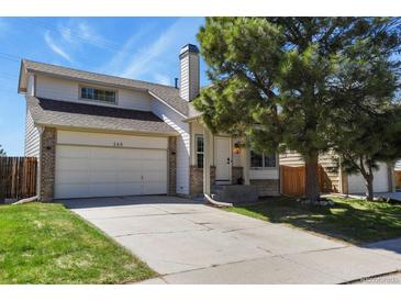 Charming two-story home with a brick and siding exterior and a well-maintained front yard at 265 N Holcomb St, Castle Rock, CO 80104