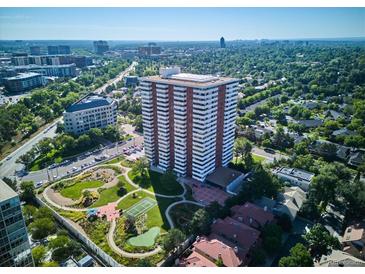Stunning aerial view of high-rise condo building surrounded by lush greenery and park at 3131 E Alameda Ave # 1107, Denver, CO 80209