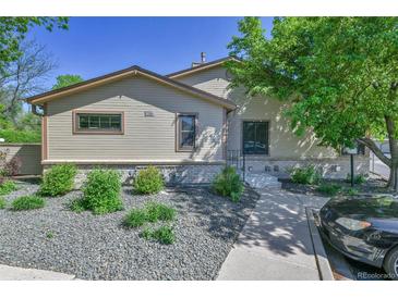 Inviting single-story home with well-maintained front yard and charming curb appeal at 9177 W Cedar Dr # D, Lakewood, CO 80226