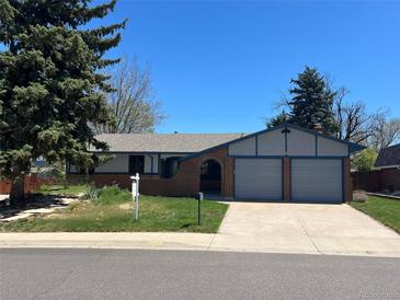 Charming single story home featuring brick accents and a two-car garage at 3762 S Fenton Way, Denver, CO 80235