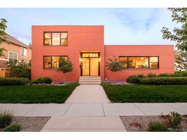 Striking contemporary home featuring a bold red brick exterior and well-manicured front lawn at 1188 S Sherman St, Denver, CO 80210
