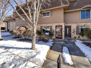 Attractive exterior of a townhome with a walkway and landscaping at 1772 Robb St, Lakewood, CO 80215