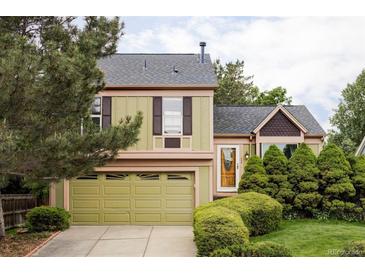 Charming two-story home featuring a well-manicured front yard and attached two-car garage at 11502 W 101St Avenue, Westminster, CO 80021