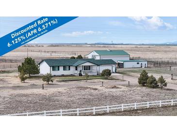 Charming ranch style house with a barn and horse pasture in a rural setting at 32350 E 137Th Way, Brighton, CO 80603