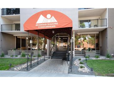 Welcoming entrance to Mountain Shadows Condominiums featuring well-maintained landscaping at 2 Adams St # 1504, Denver, CO 80206
