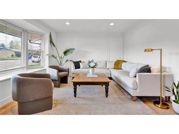 Bright living room featuring neutral tones, contemporary furniture, and stylish decor for a welcoming atmosphere at 4262 E Fremont Pl, Centennial, CO 80122