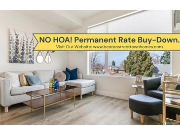 Bright living room featuring modern furnishings, stylish decor, and a large window offering natural light at 5363 W 14Th Ave, Lakewood, CO 80214