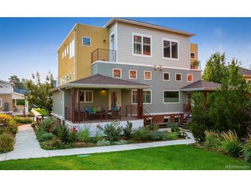 Stunning multi-story home featuring a covered front porch, a mix of modern colors, and professional landscaping at 1231 Cedar Ave, Boulder, CO 80304