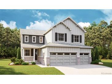 Charming two-story home featuring board and batten siding, a three-car garage, and a welcoming front porch at 7016 E 126Th Pl, Thornton, CO 80602
