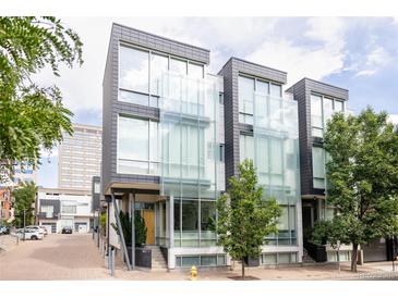 Modern townhomes boast striking architecture with large glass window panels at 1467 Delgany St # 1, Denver, CO 80202