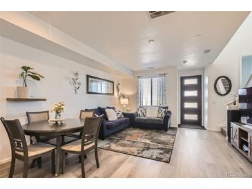 Inviting living room with modern furniture, stylish decor, and light wood floors for a cozy, contemporary feel at 5332 13Th St, Frederick, CO 80504