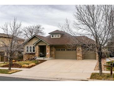 Charming single-Gathering home with a well-manicured front yard and a spacious three-car garage at 25015 E Park Crescent Dr, Aurora, CO 80016