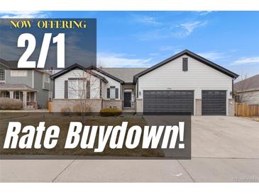 Charming single Gathering home featuring a two car garage, neat landscaping, and a classic, neutral color palette at 17161 E Dewberry Dr, Parker, CO 80134
