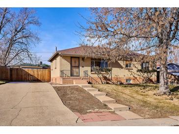 Charming brick home with a well-maintained lawn and inviting front entrance at 2555 S Tennyson Way, Denver, CO 80219