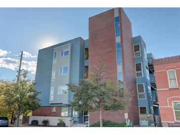 Modern brick building exterior with street view and landscaping at 2460 W 29Th Ave # 303, Denver, CO 80211