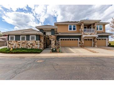 Charming multi-Gathering home featuring stone accents, multiple garages and inviting curb appeal at 3577 Molly Cir, Broomfield, CO 80023