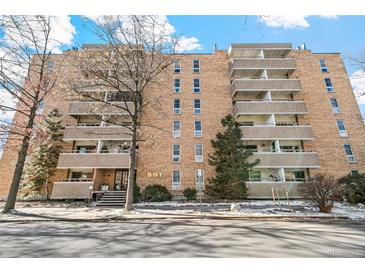 Brick apartment building with multiple levels and balconies at 551 N Pearl St # 301, Denver, CO 80203