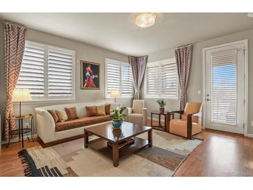 Inviting living room with plentiful natural light, neutral tones, and stylish furnishings at 4205 E Iliff Ave # 5, Denver, CO 80222